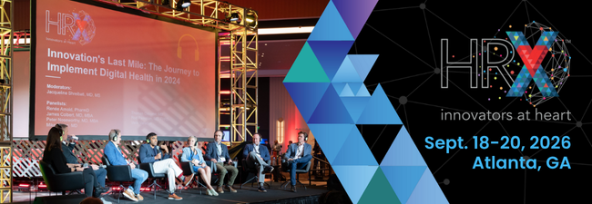 Speakers on stage during panel discussion